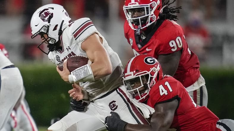 Sep 18, 2021; Athens, Georgia, USA; Georgia Bulldogs linebacker Channing Tindall (41) tackles South Carolina Gamecocks quarterback Luke Doty (4) during the second half at Sanford Stadium. Mandatory Credit: Dale Zanine-USA TODAY Sports