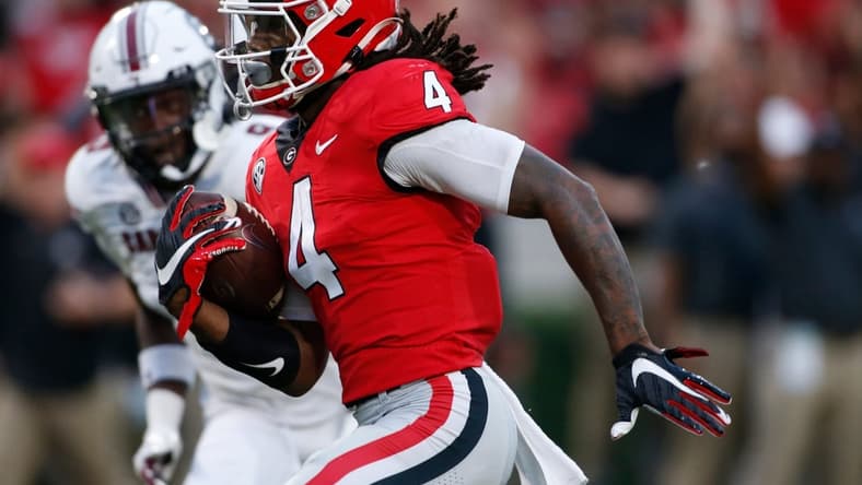 Georgia running back James Cook (4) drives in for a touchdown during the first half of an NCAA college football game between South Carolina and Georgia in Athens, Ga., on Sept. 18, 2021.
News Joshua L Jones