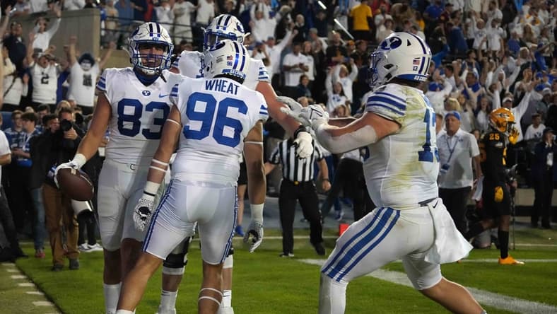 Sep 18, 2021; Provo, Utah, USA; BYU Cougars tight end Isaac Rex (83) celebrates with teammates after scoring on a 3-yard touchdown reception in the fourth quarter against the Arizona State Sun Devils at LaVell Edwards Stadium. Mandatory Credit: Kirby Lee-USA TODAY Sports