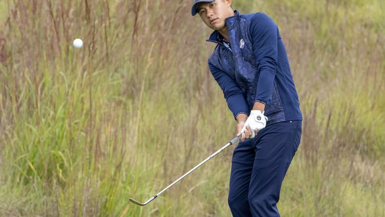 September 21, 2021; Kohler, Wisconsin, USA; U.S. Team player Collin Morikawa hits a chip shot on the practice area during a practice round for the 43rd Ryder Cup golf competition at Whistling Straits. Mandatory Credit: Kyle Terada-USA TODAY Sports