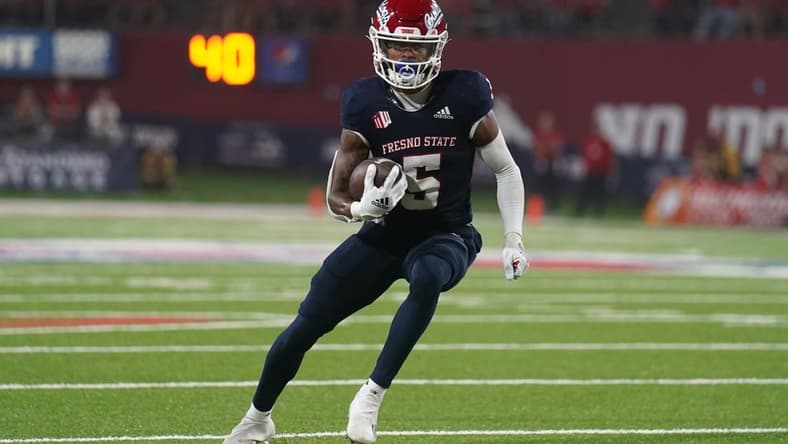 Sep 24, 2021; Fresno, California, USA; Fresno State Bulldogs wide receiver Jalen Cropper (5) runs the ball against the UNLV Rebels in the third quarter at Bulldog Stadium. Mandatory Credit: Cary Edmondson-USA TODAY Sports