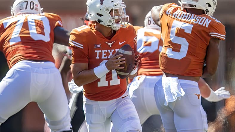 Sep 25, 2021; Austin, Texas, USA; Texas Longhorns quarterback Casey Thompson (11) looks to pass against the Texas Tech Red Raiders during the first quarter at Darrell K Royal-Texas Memorial Stadium. Mandatory Credit: John Gutierrez-USA TODAY Sports