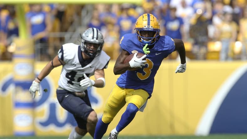 Sep 25, 2021; Pittsburgh, Pennsylvania, USA;  Pittsburgh Panthers wide receiver Jordan Addison (3) runs after a catch on his way to scoring a touchdown as New Hampshire Wildcats defensive back Noah Palm (44) chases during the second quarter at Heinz Field. Mandatory Credit: Charles LeClaire-USA TODAY Sports