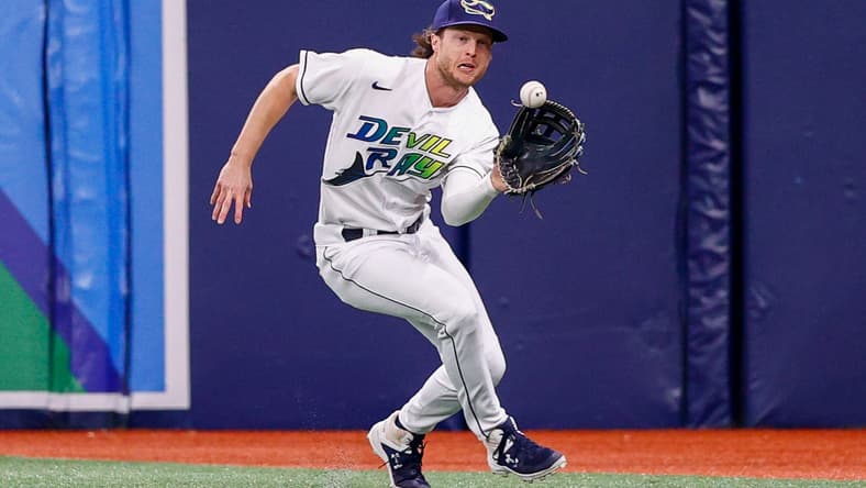 Sep 25, 2021; St. Petersburg, Florida, USA; Tampa Bay Rays right fielder Brett Phillips (35) fields the ball in the second inning against the Miami Marlins at Tropicana Field. Mandatory Credit: Nathan Ray Seebeck-USA TODAY Sports