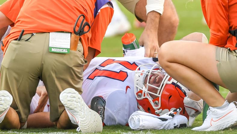 Clemson defensive lineman Bryan Bresee (11) is looked at by trainers after being injured during the third quarter at Carter-Finley Stadium in Raleigh, N.C., September 25, 2021.  The Tigers lost 27-21 in two overtimes game at Carter-Finley Stadium in Raleigh, N.C., September 25, 2021.

Ncaa Football Clemson At Nc State