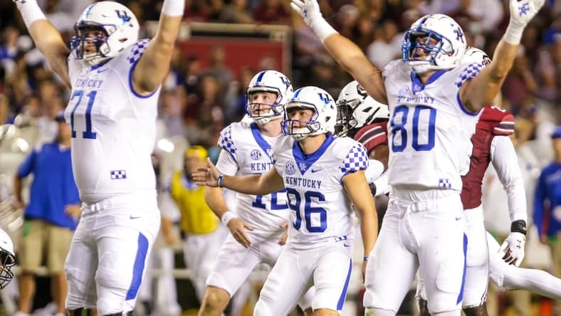 Sep 25, 2021; Columbia, South Carolina, USA; Kentucky Wildcats offensive tackle John Young (71) and tight end Brenden Bates (80) react after a successful field goal attempt by place kicker Matt Ruffolo (96) against the South Carolina Gamecocks in the second quarter at Williams-Brice Stadium. Mandatory Credit: Jeff Blake-USA TODAY Sports