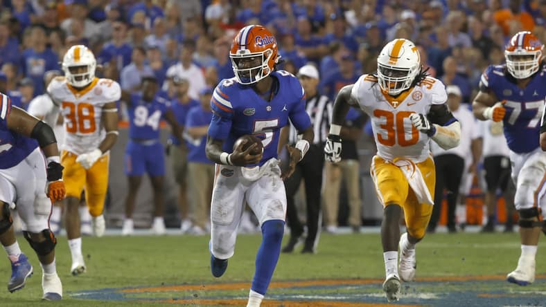 Sep 25, 2021; Gainesville, Florida, USA; Florida Gators quarterback Emory Jones (5) runs with the ball against the Tennessee Volunteers during the third quarter at Ben Hill Griffin Stadium. Mandatory Credit: Kim Klement-USA TODAY Sports