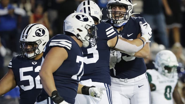 Sep 25, 2021; Provo, Utah, USA; Brigham Young Cougars fullback Masen Wake (13) celebrates his touchdown with tight end Isaac Rex (83) in the first quarter against the South Florida Bulls at LaVell Edwards Stadium. Mandatory Credit: Jeffrey Swinger-USA TODAY Sports