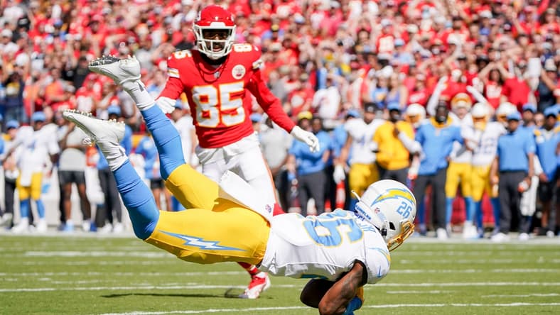 Sep 26, 2021; Kansas City, Missouri, USA; Los Angeles Chargers cornerback Asante Samuel Jr. (26) intercepts a pass intended for Kansas City Chiefs wide receiver Marcus Kemp (85) during the first half at GEHA Field at Arrowhead Stadium. Mandatory Credit: Denny Medley-USA TODAY Sports
