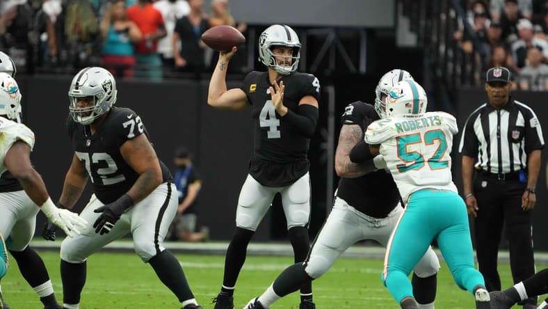 Sep 26, 2021; Paradise, Nevada, USA; Las Vegas Raiders quarterback Derek Carr (4) throws the ball in the first quarter against the Miami Dolphins at Allegiant Stadium. Mandatory Credit: Kirby Lee-USA TODAY Sports
