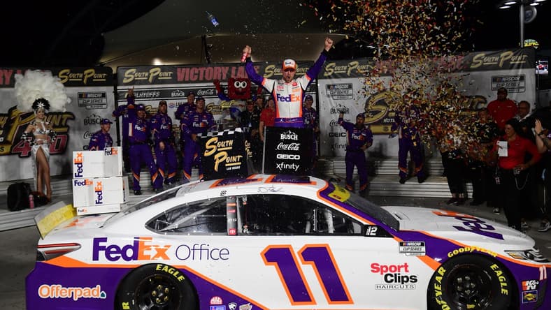 Sep 26, 2021; Las Vegas, Nevada, USA; NASCAR Cup Series driver Denny Hamlin (11) celebrates his victory of  the South Point 400 at Las Vegas Motor Speedway. Mandatory Credit: Gary A. Vasquez-USA TODAY Sports