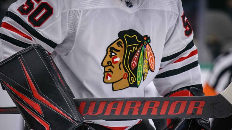 Feb 23, 2020; Dallas, Texas, USA; A view of the logo and hockey stick of Chicago Blackhawks goaltender Corey Crawford (50) in action during the game between the Stars and the Blackhawks at the American Airlines Center. Mandatory Credit: Jerome Miron-USA TODAY Sports