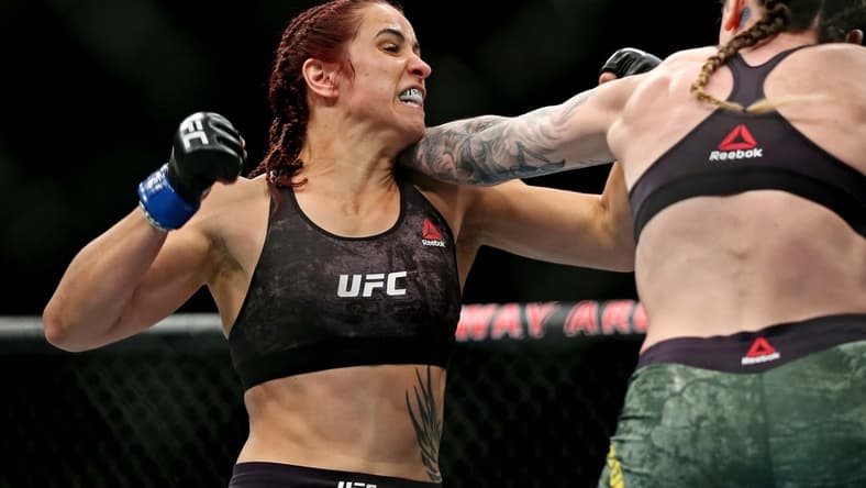 Feb 29, 2020; Norfolk, Virginia, USA; Megan Anderson (red gloves) fights Norma Dumont (blue gloves) during UFC Fight Night at Chartway Arena. Mandatory Credit: Peter Casey-USA TODAY Sports