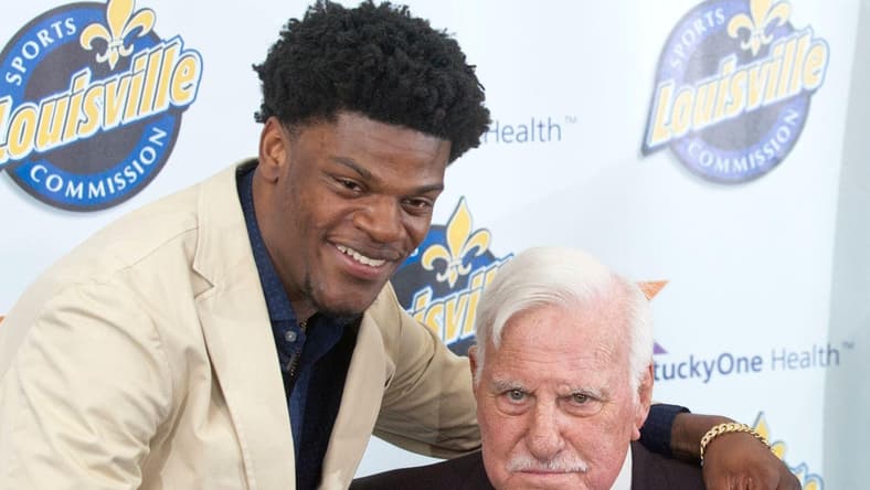 Baltimore Ravens quarterback Lamar Jackson, a former University of Louisville quarterback, puts his arm around former Cardinals head football coach Howard Schnellenberger in the VIP room of the Louisville Sports Commission's 2019 Paul Hornung Award Banquet.

ghows-LK-200608298-f26786f2.jpg