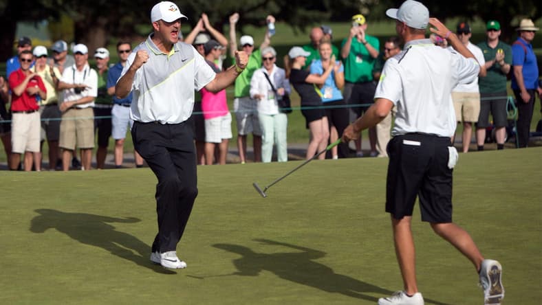 Oregon head coach Casey Martin celebrates with golfer  Sulman Raza after Raza made the match winning putt in his semifinal match against Illinois' Charlie Danielson to send the Ducks into the finals of the NCAA men's golf championship at Eugene Country Club in Eugene in 2016. [Andy Nelson/The Register-Guard] - registerguard.com

4he6klekv3h0a5c7xhglzbhb7vy