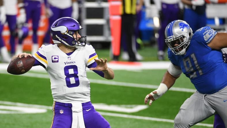 Jan 3, 2021; Detroit, Michigan, USA; Minnesota Vikings quarterback Kirk Cousins (8) throws a pass as Detroit Lions defensive tackle John Penisini (91) pressures during the first quarter at Ford Field. Mandatory Credit: Tim Fuller-USA TODAY Sports