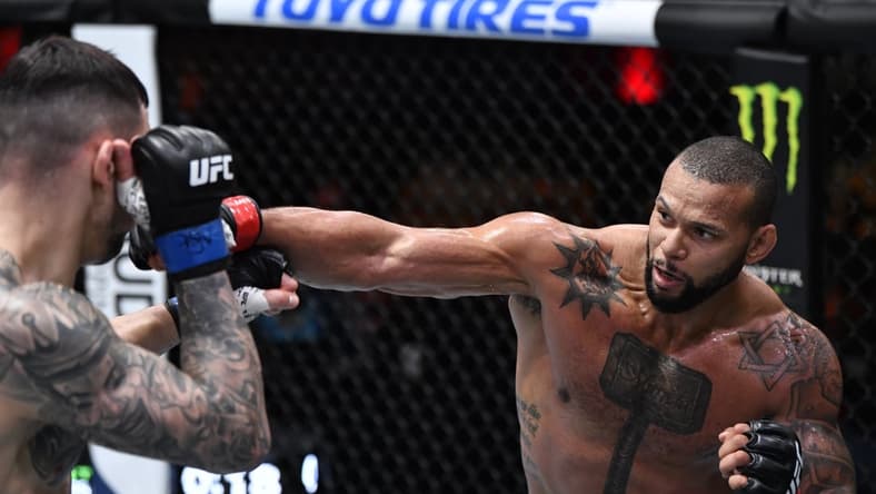 Mar 6, 2021; Las Vegas, NV, USA;  Thiago Santos of Brazil punches Aleksandar Rakic of Austria in their light heavyweight fight during the UFC 259 event at UFC APEX on March 06, 2021 in Las Vegas, Nevada. Mandatory Credit: Jeff Bottari/Handout Photo via USA TODAY Sports