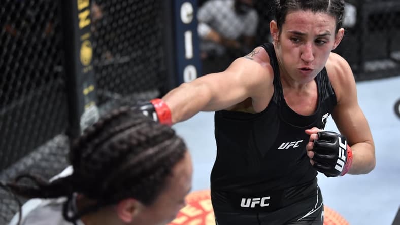 May 8, 2021; Las Vegas, NV, USA; Marina Rodriguez of Brazil punches Michelle Waterson in a flyweight fight during the UFC Fight Night event at UFC APEX on May 08, 2021 in Las Vegas, Nevada.    Mandatory Credit: Chris Unger/Handout Photo via USA TODAY Sports