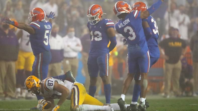 After a tackle Florida Gators defensive back Marco Wilson (3) throws the shoe of LSU tight end Kole Taylor (87) which resulted in a personal foul penalty against Wilson, during a game against the LSU Tigers at Ben Hill Griffin Stadium in Gainesville, Fla. Dec. 12, 2020. Florida lost 37-34 to the Tigers.

Sports Mcclenny02