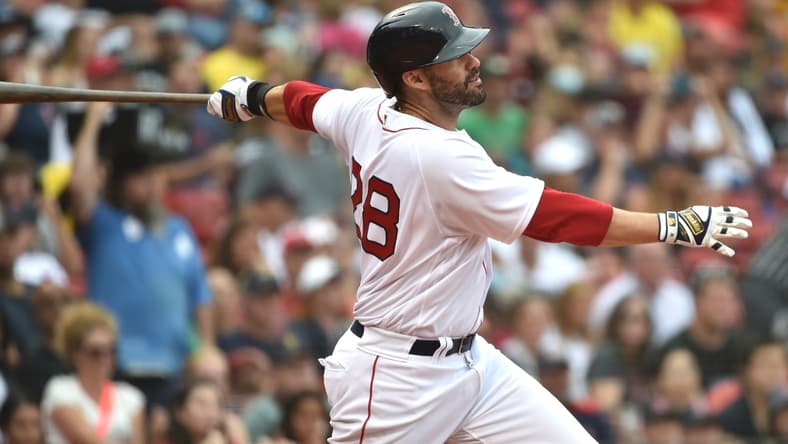 Sep 5, 2021; Boston, Massachusetts, USA; Boston Red Sox designated hitter J.D. Martinez (28) hits a two run home run during the sixth inning against the Cleveland Indians at Fenway Park. Mandatory Credit: Bob DeChiara-USA TODAY Sports