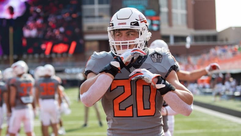 Sep 11, 2021; Stillwater, Oklahoma, USA; Oklahoma State Cowboys linebacker Malcolm Rodriguez (20) warms up before the game against the Tulsa Golden Hurricane at Boone Pickens Stadium. Mandatory Credit: Brett Rojo-USA TODAY Sports