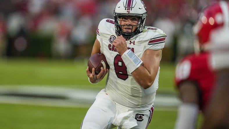 Sep 18, 2021; Athens, Georgia, USA; South Carolina Gamecocks quarterback Zeb Noland (8) runs the ball against the Georgia Bulldogs during the first quarter at Sanford Stadium. Mandatory Credit: Dale Zanine-USA TODAY Sports