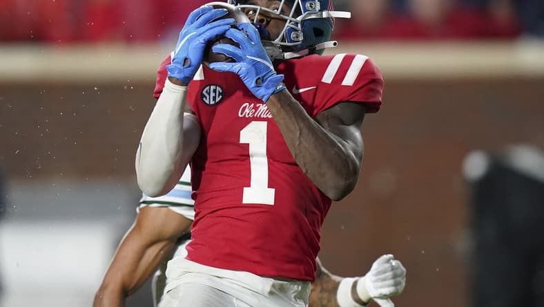 Sep 18, 2021; Oxford, Mississippi, USA; Mississippi Rebels wide receiver Jonathan Mingo (1) catches a touchdown pass against Tulane Green Wave at Vaught-Hemingway Stadium. Mandatory Credit: Marvin Gentry-USA TODAY Sports