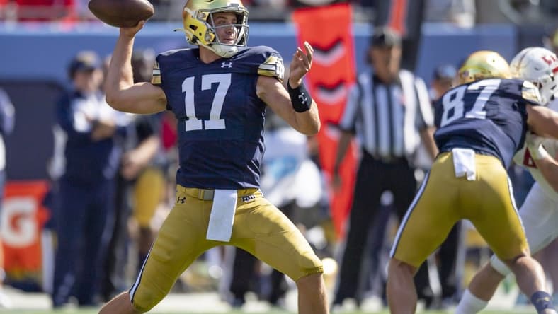 Sep 25, 2021; Chicago, Illinois, USA; Notre Dame Fighting Irish quarterback Jack Coan (17) passes during the first half against the Wisconsin Badgers at Soldier Field. Mandatory Credit: Patrick Gorski-USA TODAY Sports