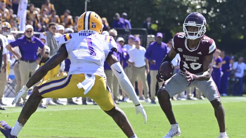 Sep 25, 2021; Starkville, Mississippi, USA; Mississippi State Bulldogs wide receiver Makai Polk (10) runs the ball while defended by LSU Tigers cornerback Eli Ricks (1) during the fourth quarter at Davis Wade Stadium at Scott Field. Mandatory Credit: Matt Bush-USA TODAY Sports