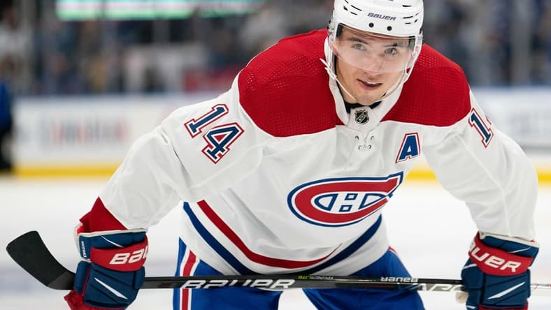 Sep 25, 2021; Toronto, Ontario, CAN; Montreal Canadiens center Nick Suzuki (14) gets ready for the face-off during the first period against the Toronto Maple Leafs at Scotiabank Arena. Mandatory Credit: Nick Turchiaro-USA TODAY Sports