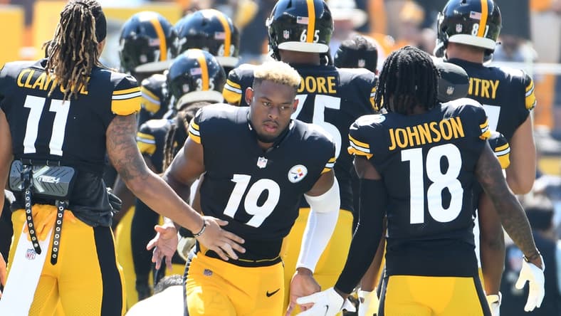 Sep 19, 2021; Pittsburgh, Pennsylvania, USA;  Pittsburgh Steelers wide receiver JuJu Smith-Schuster is greeted by his teammates as they take the field to play the Las Vegas Raiders  at Heinz Field. The Raiders won the game 26-17. Mandatory Credit: Philip G. Pavely-USA TODAY Sports