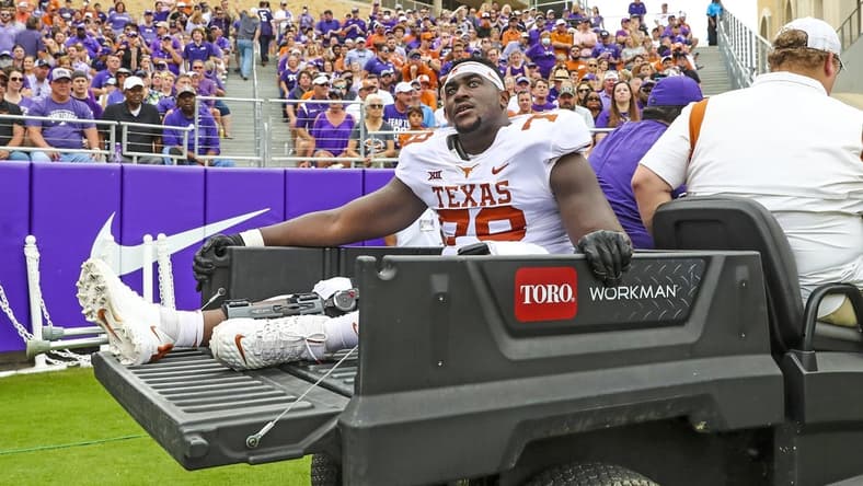 Oct 2, 2021; Fort Worth, Texas, USA; Texas Longhorns offensive lineman Denzel Okafor (78) leaves the game on a cart during the first half against the TCU Horned Frogs at Amon G. Carter Stadium. Mandatory Credit: Kevin Jairaj-USA TODAY Sports