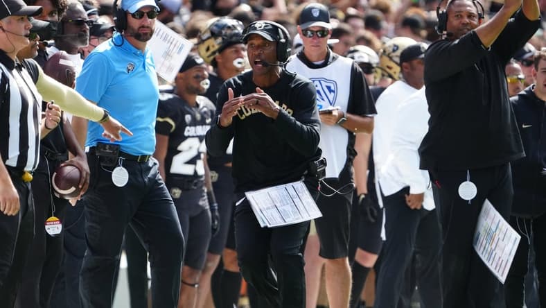 Oct 2, 2021; Boulder, Colorado, USA; Colorado Buffaloes head coach Karl Dorrell calls a time out n the second quarter against the USC Trojans at Folsom Field. Mandatory Credit: Ron Chenoy-USA TODAY Sports