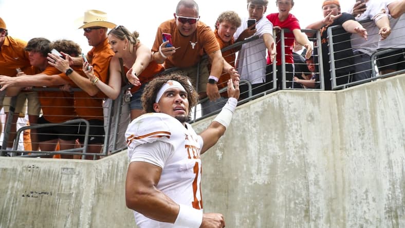 Oct 2, 2021; Fort Worth, Texas, USA; Texas Longhorns quarterback Casey Thompson (11) shakes hands with fans after the game against the TCU Horned Frogs at Amon G. Carter Stadium. Mandatory Credit: Kevin Jairaj-USA TODAY Sports