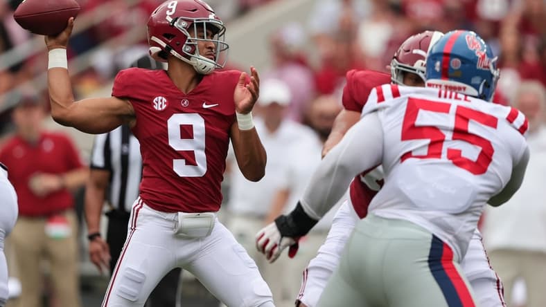 Oct 2, 2021; Tuscaloosa, Alabama, USA;  Alabama Crimson Tide quarterback Bryce Young (9) throws a pass during the first half of an NCAA college football game against the Mississippi Rebels at Bryant-Denny Stadium. Mandatory Credit: Butch Dill-USA TODAY Sports