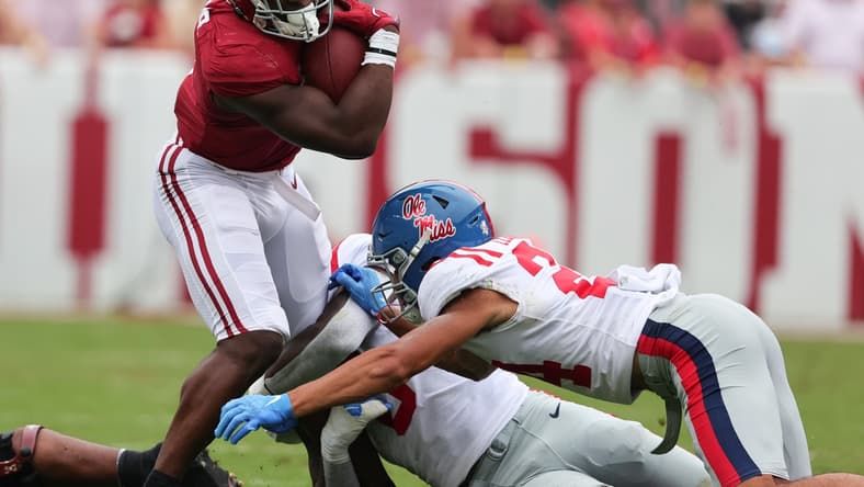 Oct 2, 2021; Tuscaloosa, Alabama, USA; Alabama Crimson Tide running back Brian Robinson Jr. (4) carries the ball against the Mississippi Rebels during the first half of an NCAA college football game at Bryant-Denny Stadium. Mandatory Credit: Butch Dill-USA TODAY Sports