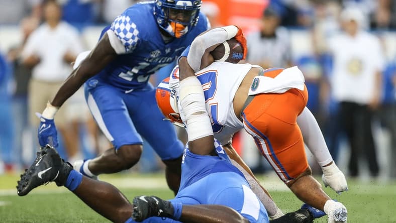Kentucky's Joshua Paschal tackles Florida's Malik Davis for a loss Saturday night at Kroger Field in Lexington. Oct. 2, 2021

Kentucky Vs Florida October 2021