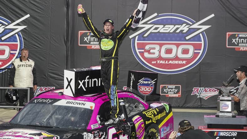 Oct 2, 2021; Talladega, AL, USA; NASCAR Xfinity Series driver Brandon Brown celebrates after he won the darkness shortened race at Talladega Speedway. Mandatory Credit: Marvin Gentry-USA TODAY Sports