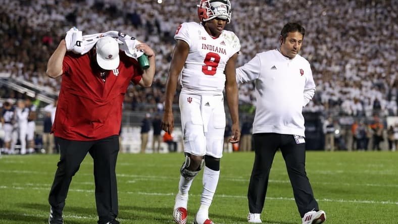 Oct 2, 2021; University Park, Pennsylvania, USA; Indiana Hoosiers quarterback Michael Penix Jr. (9) walks off the field after suffering an injury during the third quarter against the Penn State Nittany Lions at Beaver Stadium. Mandatory Credit: Matthew OHaren-USA TODAY Sports