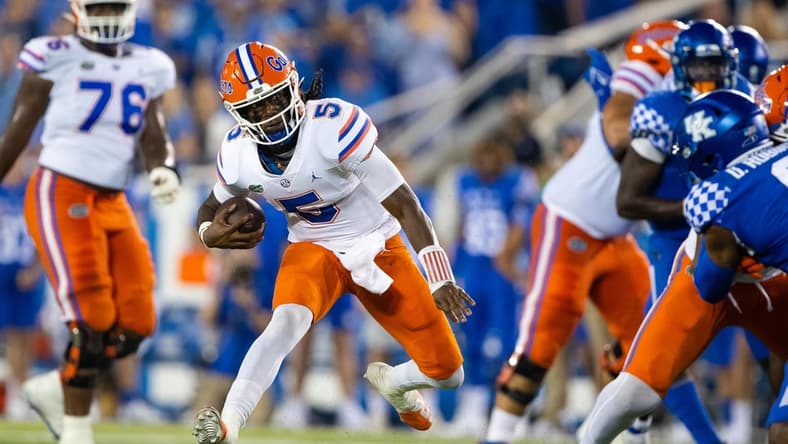 Oct 2, 2021; Lexington, Kentucky, USA; Florida Gators quarterback Emory Jones (5) runs the ball against the Kentucky Wildcats during the fourth quarter at Kroger Field. Mandatory Credit: Jordan Prather-USA TODAY Sports