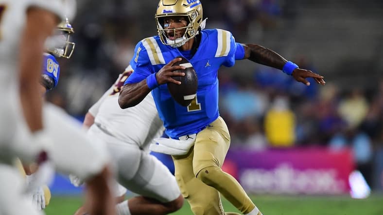 Oct 2, 2021; Pasadena, California, USA; UCLA Bruins quarterback Dorian Thompson-Robinson (1) runs the ball against the Arizona State Sun Devils during the first half at Rose Bowl. Mandatory Credit: Gary A. Vasquez-USA TODAY Sports