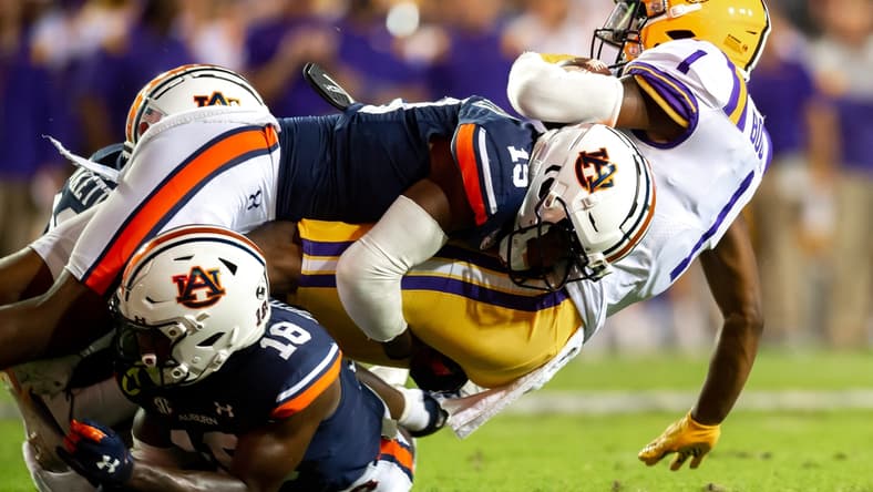 Kayshon Boutte 1 is tackled as The LSU Tigers take on the Auburn Tigers in Tiger Stadium. Saturday, Oct. 2, 2021.

Half 1 Lsu Vs Auburn Football 0805