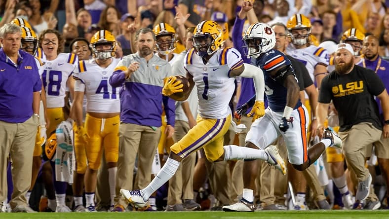 Kayshon Boutte (5) gained 55 yards on LSU's first play and capped the drive with a 31-yard touchdown reception.

Syndication The Daily Advertiser
