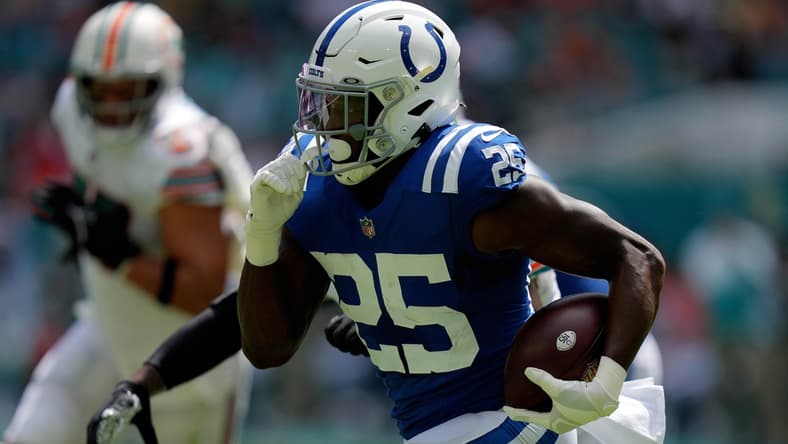 Oct 3, 2021; Miami Gardens, Florida, USA; Indianapolis Colts running back Marlon Mack (25) runs the ball against the Miami Dolphins during the first half at Hard Rock Stadium. Mandatory Credit: Jasen Vinlove-USA TODAY Sports