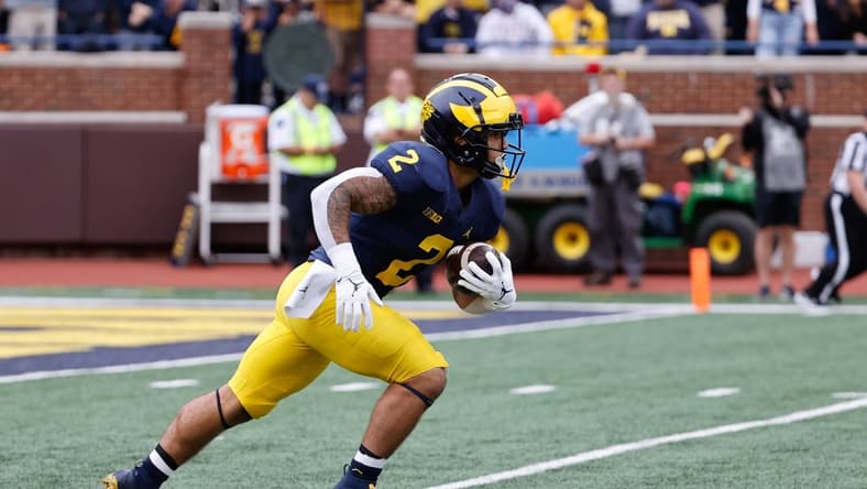 Sep 25, 2021; Ann Arbor, Michigan, USA; Michigan Wolverines running back Blake Corum (2) runs the ball against the Rutgers Scarlet Knights at Michigan Stadium. Mandatory Credit: Rick Osentoski-USA TODAY Sports