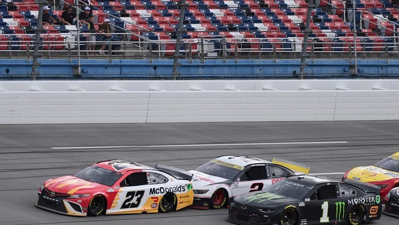 Oct 4, 2021; Talladega, Alabama, USA; NASCAR Cup Series driver Bubba Wallace (23) leads a pack of cars during the YellaWood 500 at Talladega Superspeedway. Mandatory Credit: Adam Hagy-USA TODAY Sports