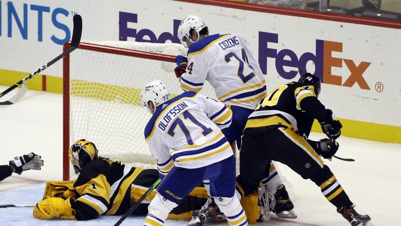 Oct 5, 2021; Pittsburgh, Pennsylvania, USA; Buffalo Sabres right wing Victor Olofsson (71) scores a goal against Pittsburgh Penguins goaltender Casey DeSmith (1) during the second period at PPG Paints Arena. Mandatory Credit: Charles LeClaire-USA TODAY Sports