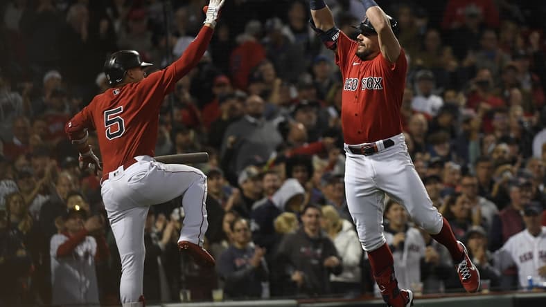 Oct 5, 2021; Boston, Massachusetts, USA; Boston Red Sox designated hitter Kyle Schwarber (18) celebrates with center fielder Enrique Hernandez (5) after hitting a solo home run against the New York Yankees during the third inning of the American League Wildcard game at Fenway Park. Mandatory Credit: Bob DeChiara-USA TODAY Sports