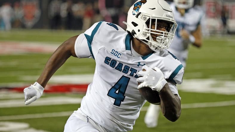 Oct 7, 2021; Jonesboro, Arkansas, USA; Coastal Carolina Chanticleers tight end Isaiah Likely (4) runs after the catch for a touchdown during the second half against the Arkansas State Red Wolves at Centennial Bank Stadium. Mandatory Credit: Petre Thomas-USA TODAY Sports