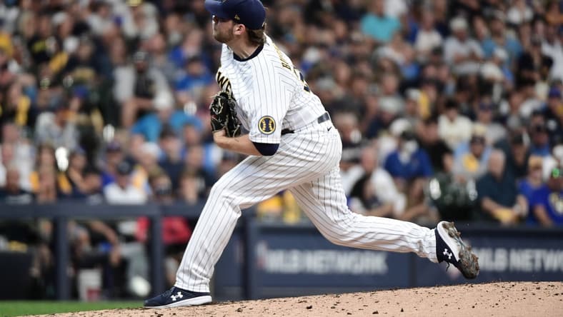 Oct 8, 2021; Milwaukee, Wisconsin, USA; Milwaukee Brewers starting pitcher Corbin Burnes (39) pitches in the fourth inning against the Atlanta Braves during game one of the 2021 NLDS at American Family Field. Mandatory Credit: Benny Sieu-USA TODAY Sports